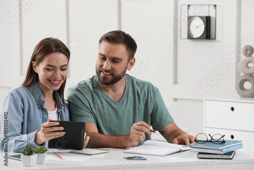 Young couple discussing family budget at home