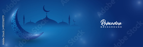 Islamic ramadan kareem banner background with crescent pattern moon star mosque lantern. Vector illustration. Ramadhan lantern blue colorful wide banner design background