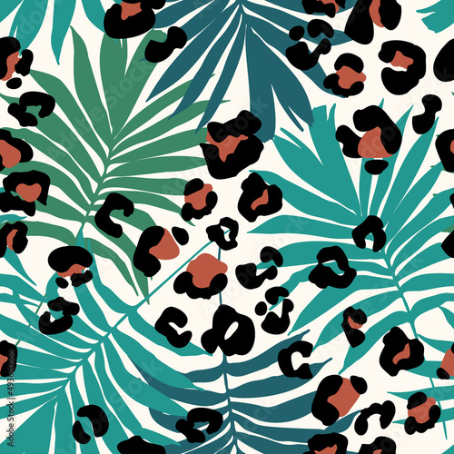 Abstract tropical floral seamless pattern with palm leaves silhouette, animal skin print