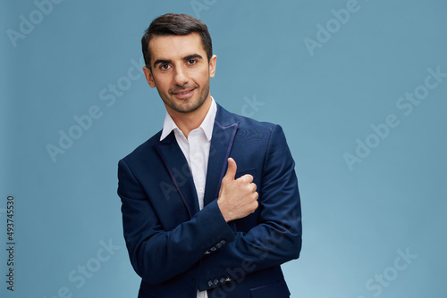 smiling man in business suit showing thumb up businessman boss employer isolated background. Copy space