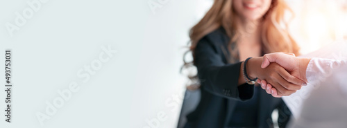 Businesswoman handshake and business people. Successful business concept. Banner background, panoramic view.