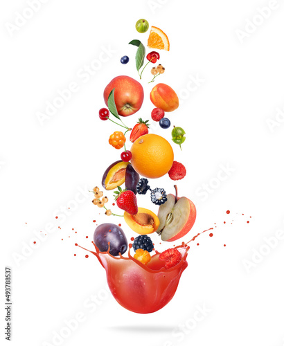 Different fruits and berries are falling in splashes of juice on a white background