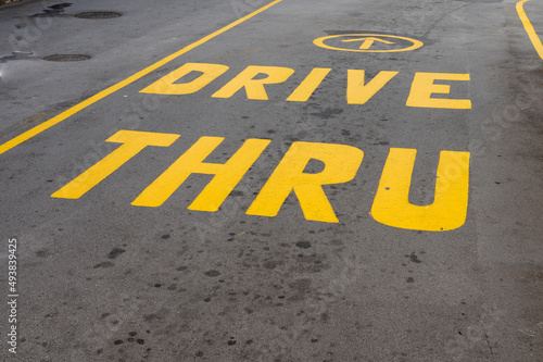 Drive thru sign painted on tarmac of local business