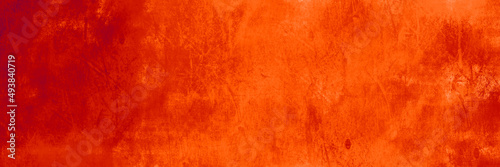 Hot red orange background with texture, old distressed metal grunge textured design in warm fall or autumn colors, October or halloween vintage metal banner or backdrop with no people