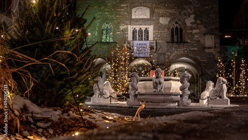 Scenic view of the Piazza Vecchia decorated with Christmas lights in Bergamo square in Italy
