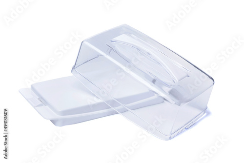 Empty plastic butter container with open transparent lid insulated on white background