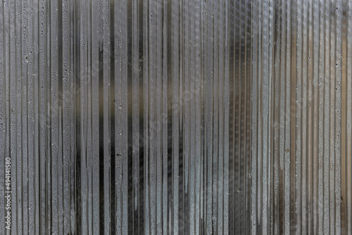 Close-up of a polycarbonate greenhouse wall. Porous polycarbonate sheet with condensation drops inside.