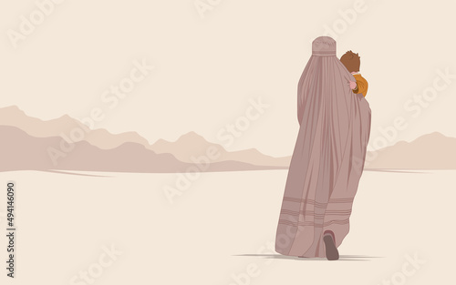 An Afghan woman in a burqa or burka with a child walks through the desert in search of freedom. Flight from the war. Refugee poster concept. Save the women of the east from violence and terrorism