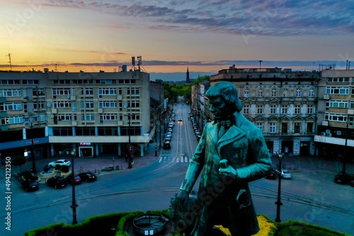 Łódź - Plac Wolności. Monument on the square during sunset.