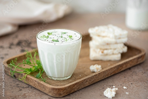 homemade natural kefir with rice cakes in a glass