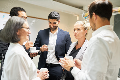 Business people drinking coffee and making small talk