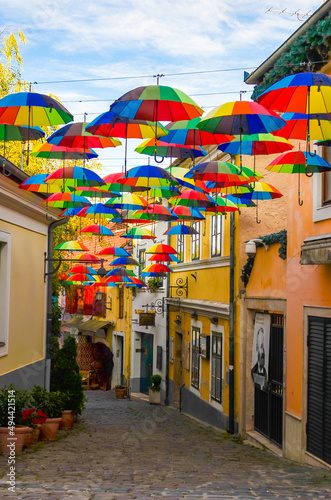 colorful umbrellas in street Szentendre city Hungaria summer vertical photo