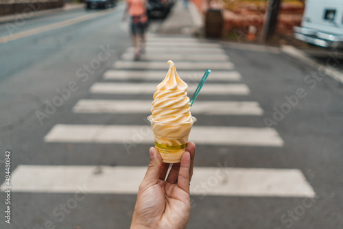 Man Holding Pineapple Dole Whip Frozen Yogurt Ice Cream On Crosswalk Street