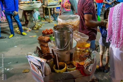 Howrah, West Bengal, India - April 14th 2019 : A roadside stall of Jhal muri , a delicious Indian bengali street food dish, being sold at bengali new year known as Gajan or Charak festival , at night.