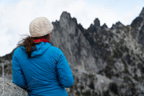 Female hiker looking at the view from the Enchantments Mountains in Washington