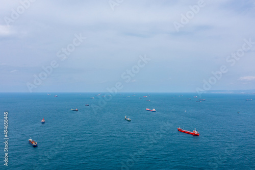 Fifty Cargo and Container ships anchored close to port due to worldwide Maritime congestion crisis, Aerial view. 