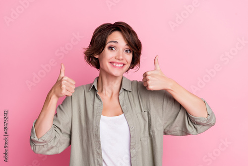 Photo of positive attractive lady show thumb up symbol suggest perfect shopping offer isolated over pastel color background