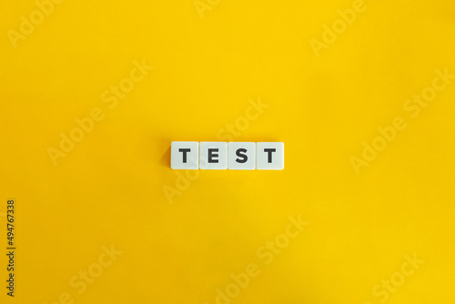 Test Word on Letter Tiles on Yellow Background. Minimal Aesthetics.