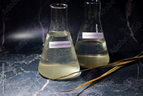 Glutaraldehyde in flasks. Chemistry, C5H8O2