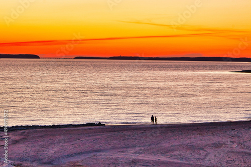 Breathtaking view of people enjoying the sunset in the Lake Red Rock, Pella, Iowa