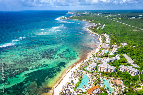 Aerial view of the Akumal Bay in Quintana Roo, Mexico during Sunset. Caribbean Sea, coral reef, top view. Beautiful tropical paradise beach