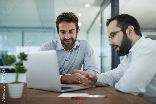 Explaining the best strategy. Shot of two businessmen having a meeting in an office.