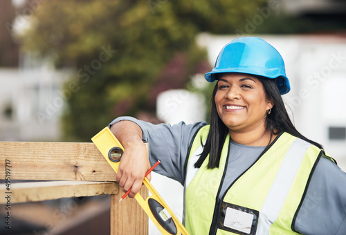 Ive got all the tools I need to succeed. Cropped portrait of an attractive young female construction worker working on site.