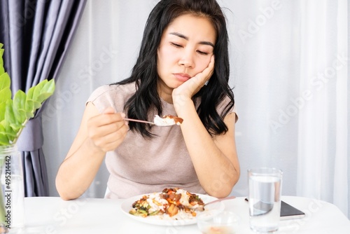 Asian woman having problem with anorexia ,bored with food, and lost appetite