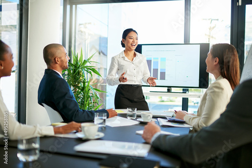 Business has been going very well so far. Cropped shot of a group of business colleagues meeting in the boardroom.