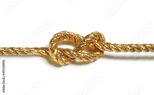 golden rope with knot isolated on white