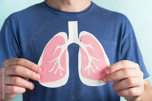 Man holding lungs decorative model. World tuberculosis TB day, pneumonia, respiratory diseases concept. Closeup