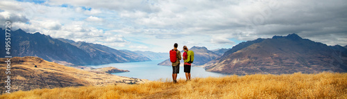 Panorama of New Zealand adventure couple hiking The Remarkables Otago