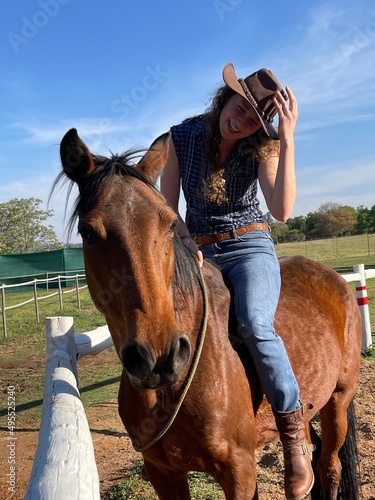 Cowgirl riding horse bareback tackless