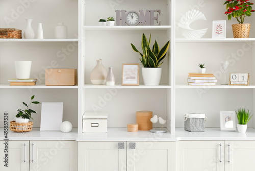 Shelf unit with beautiful decor in room