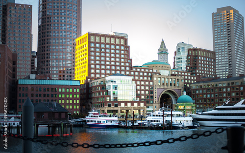 yachts and riverboats moored in Boston harbor landscape 