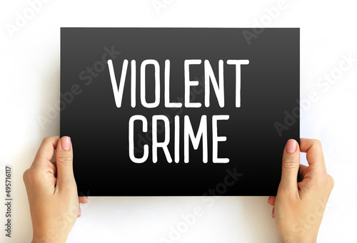 Violent crime - in which an offender or perpetrator uses or threatens to use harmful force upon a victim, text on card concept