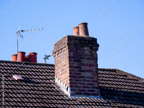 chimney and chimney pots on a tiled roofed house