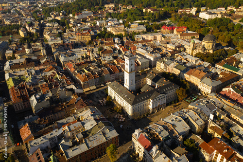 Urban landscape of the city of Lviv at sunset, streets and red roofs of houses
