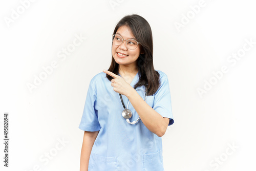 Showing Product and Pointing Side Of Asian Young Doctor Isolated On White Background