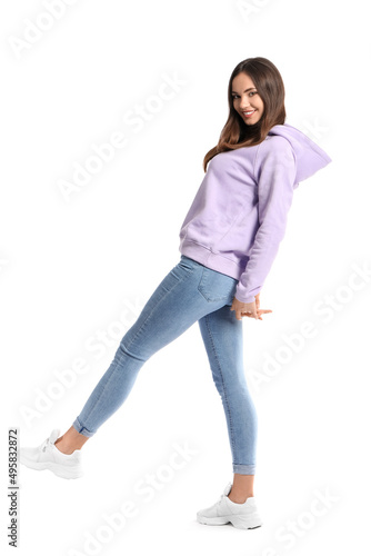 Beautiful young woman in stylish hoodie on white background