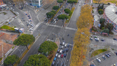 Aerial view of a road intersection on the Via Cristoforo Colombo in Rome, Italy. Many cars are in traffic.