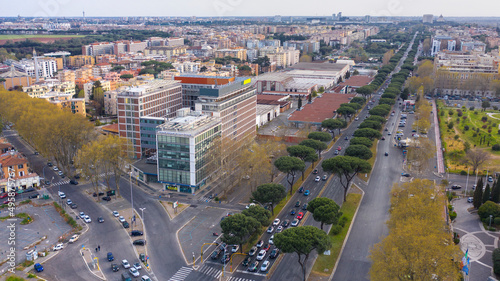 Aerial view of a road intersection on the Via Cristoforo Colombo in Rome, Italy. Many cars are in traffic.