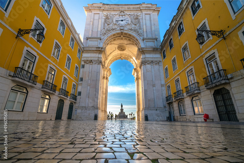 Rua Augusta Arch at sunrise in Lisbon, Portugal. Statue of King Jose I on Commerce Square at the far end