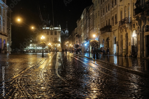 Night rainy view to the Rynok or Market Square in Lviv, Ukraine. August 2021