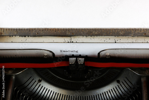 The German word Mahnung written on an old mechanical typewriter German Text: Reminder