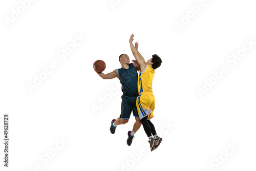 Top view of two young basketball players training with ball isolated on white studio background. Motion, activity, sport concepts.
