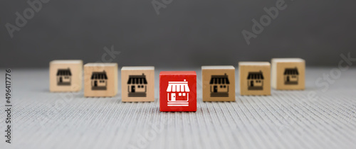 Franchise or franchising, Cube wooden toy block stack pyramid with franchises business store icon for growth and products services or grow expand or bank loan for branch expansion.