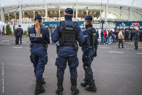 Policemen in front of the stadium before football match.