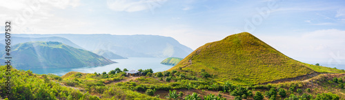 Lake Toba and Samosir Island view from above Sumatra Indonesia. Huge volcanic caldera covered by water, traditional Batak villages, green rice paddies, equatorial forest.