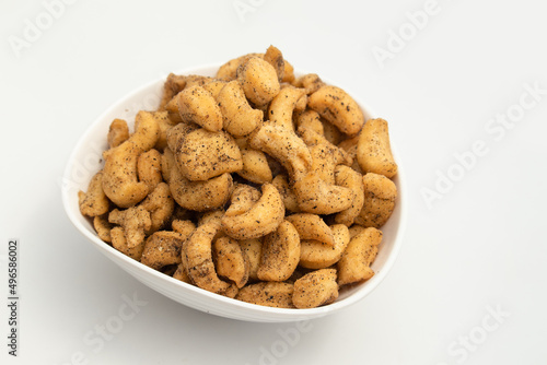 Roasted Namkeen Chatpata Masala Kaju Biscuits Are Spicy Salted Savory Made Of Wheat Flour Maida Ajwain Chilli And Sprinkle Of Black Pepper. Isolated On White Background With Copy Space